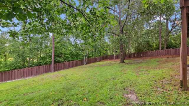 a room with pool table and windows