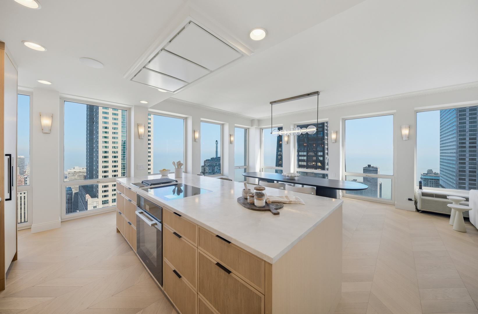 111 East Chestnut Street, Unit PHAB Chicago, IL 60611 - Photo 13 of 124 a large white kitchen with a large window and couch