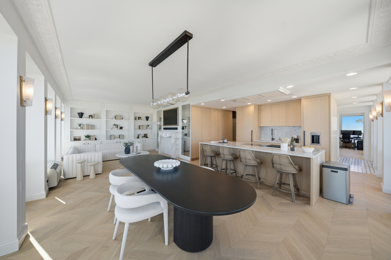 111 East Chestnut Street, Unit PHAB Chicago, IL 60611 - Photo 21 of 124 a kitchen with stainless steel appliances kitchen island granite countertop a table chairs and a refrigerator