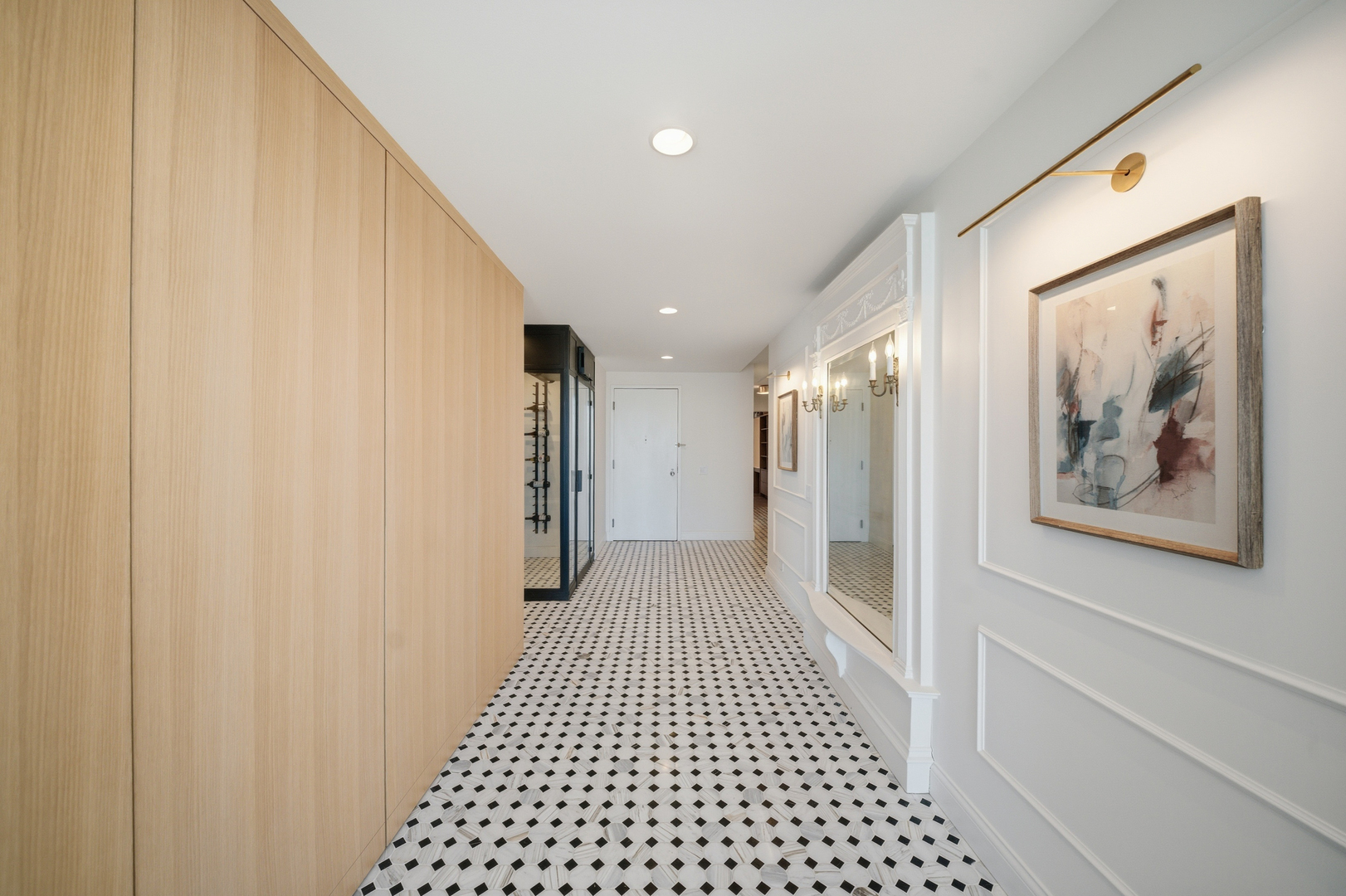 111 East Chestnut Street, Unit PHAB Chicago, IL 60611 - Photo 39 of 124 a view of a hallway with a painting on the wall