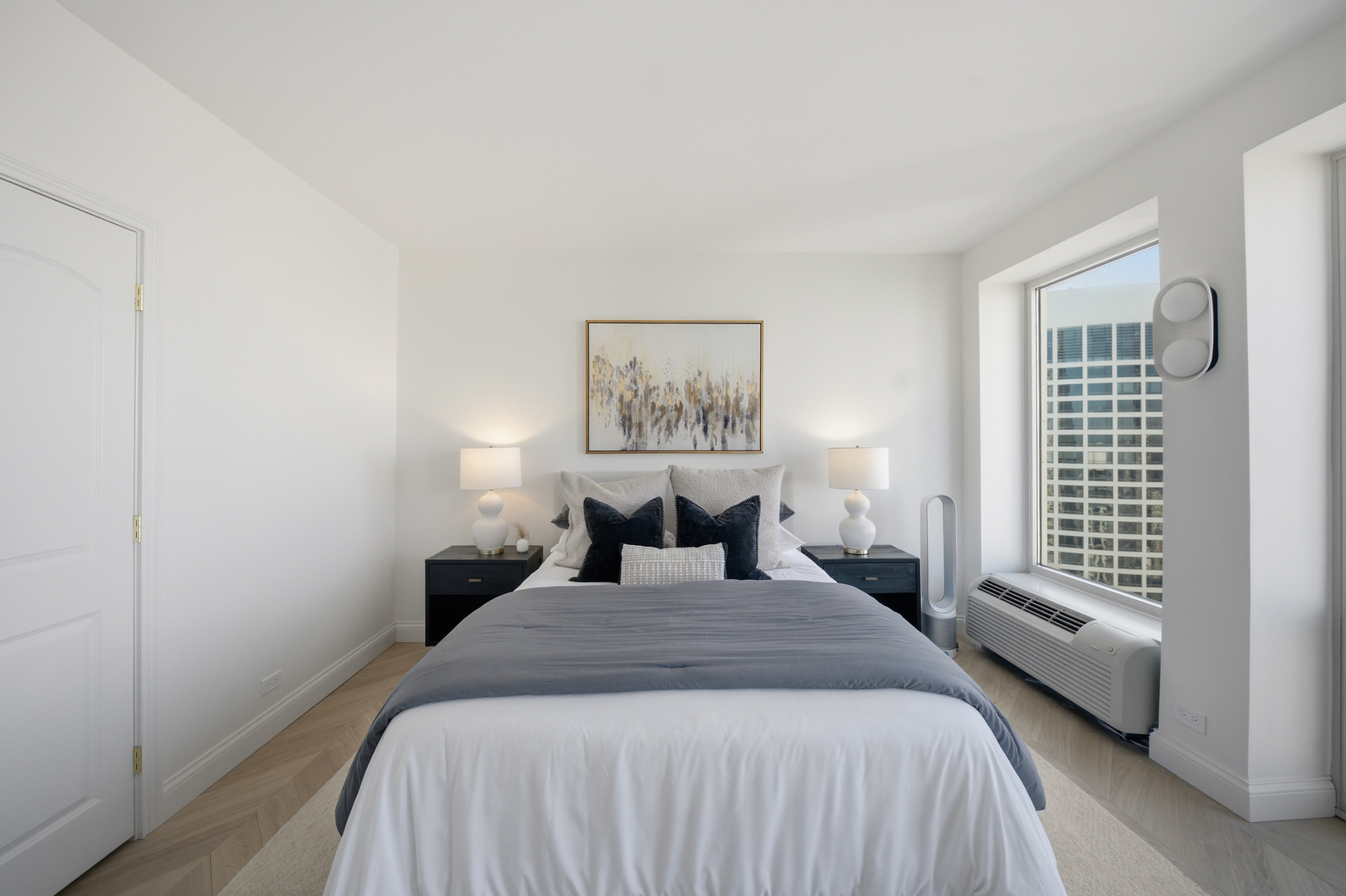 111 East Chestnut Street, Unit PHAB Chicago, IL 60611 - Photo 73 of 124 a bedroom with a large bed and a window
