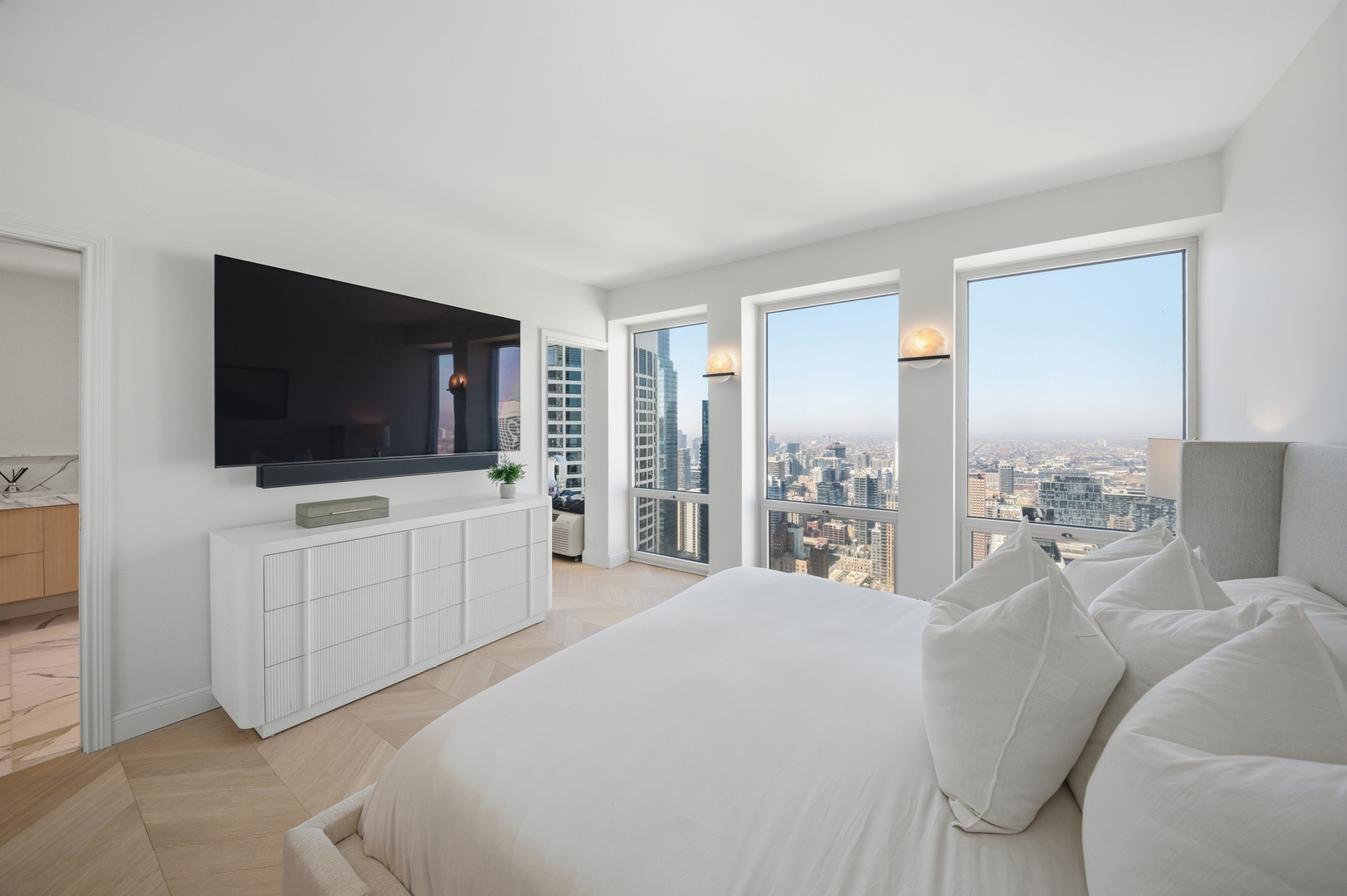 111 East Chestnut Street, Unit PHAB Chicago, IL 60611 - Photo 87 of 124 a bedroom with furniture and a flat screen tv