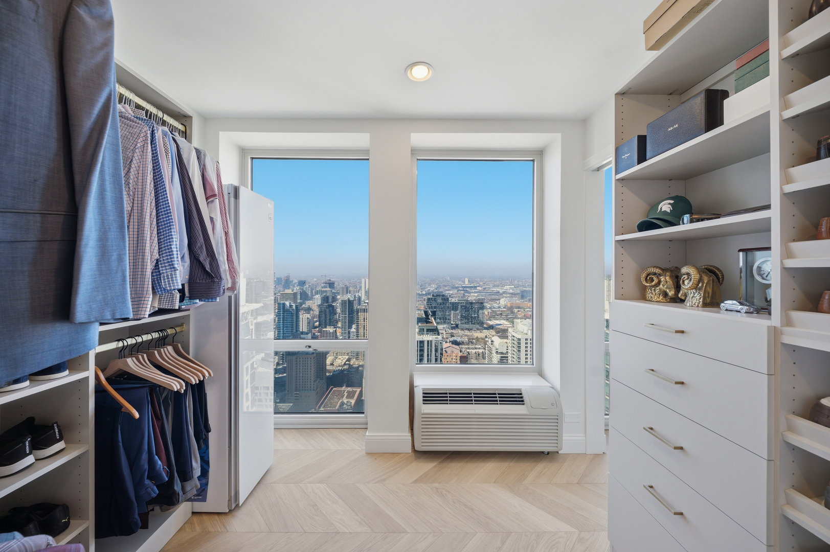 111 East Chestnut Street, Unit PHAB Chicago, IL 60611 - Photo 92 of 124 a view of walk in closet with clothes and shoes