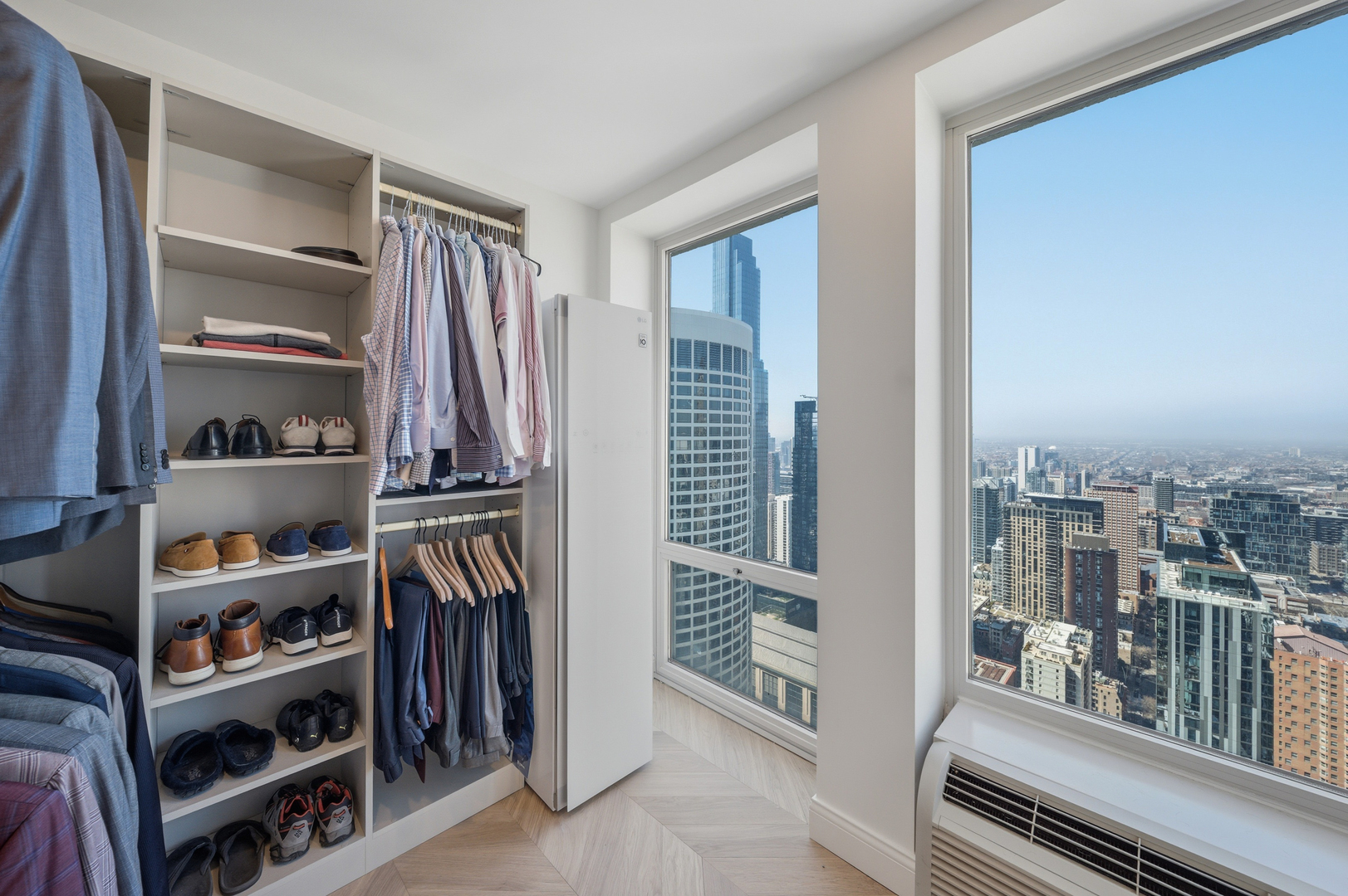 111 East Chestnut Street, Unit PHAB Chicago, IL 60611 - Photo 93 of 124 a view of walk in closet with clothes and shoes
