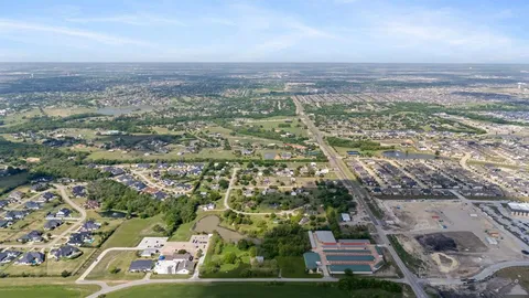 an aerial view of residential building with parking space