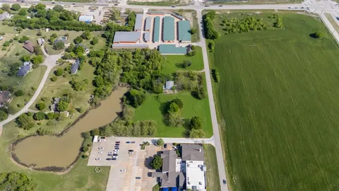 an aerial view of a residential apartment building with a yard