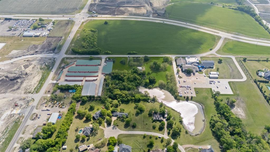 5799 North Custer Road Prosper, TX 75078 - Photo 7 of 21 an aerial view of a house with a garden and swimming pool