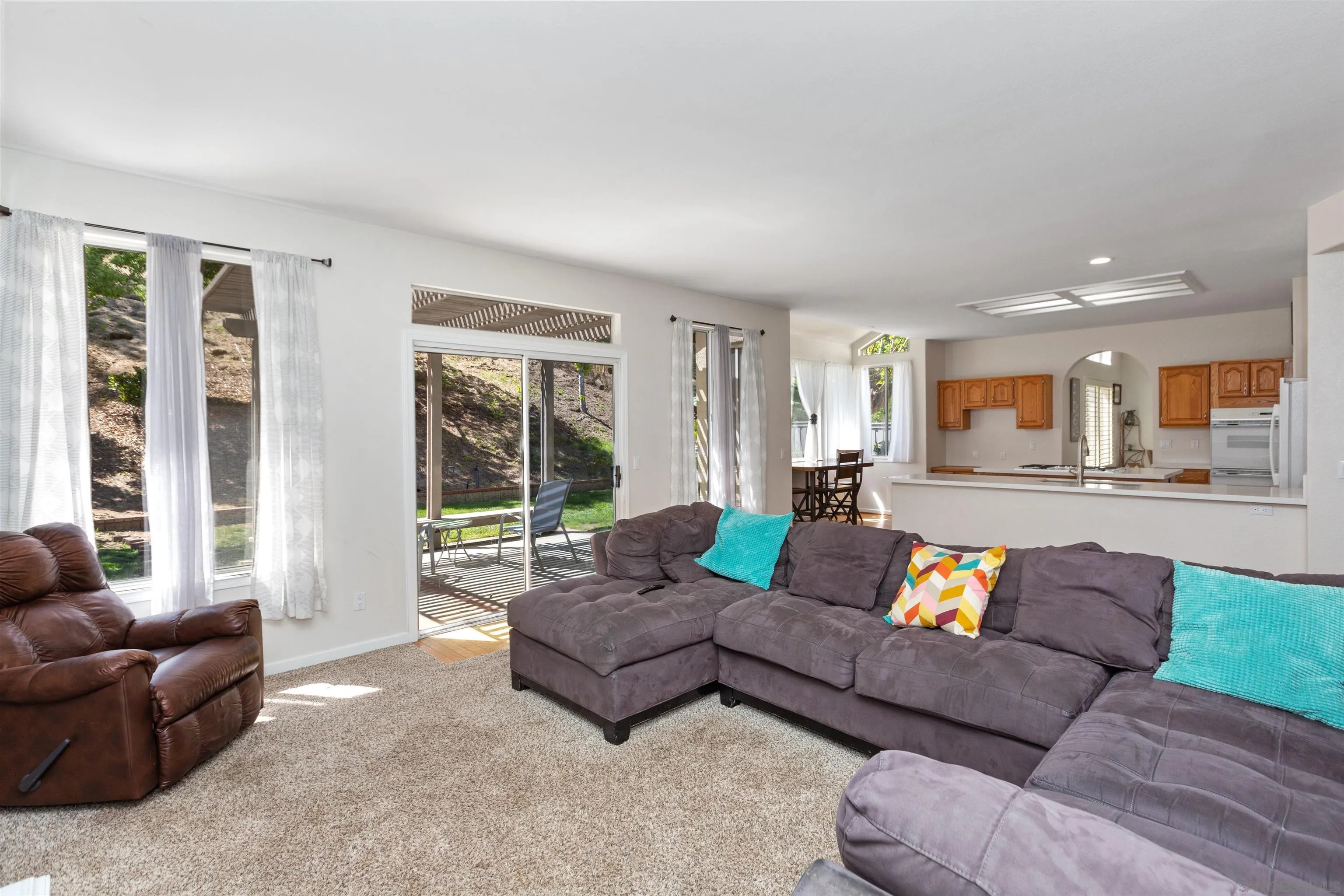 31759 Corte Rosario Temecula, CA 92592 - Photo 12 of 44 a living room with furniture and a large window