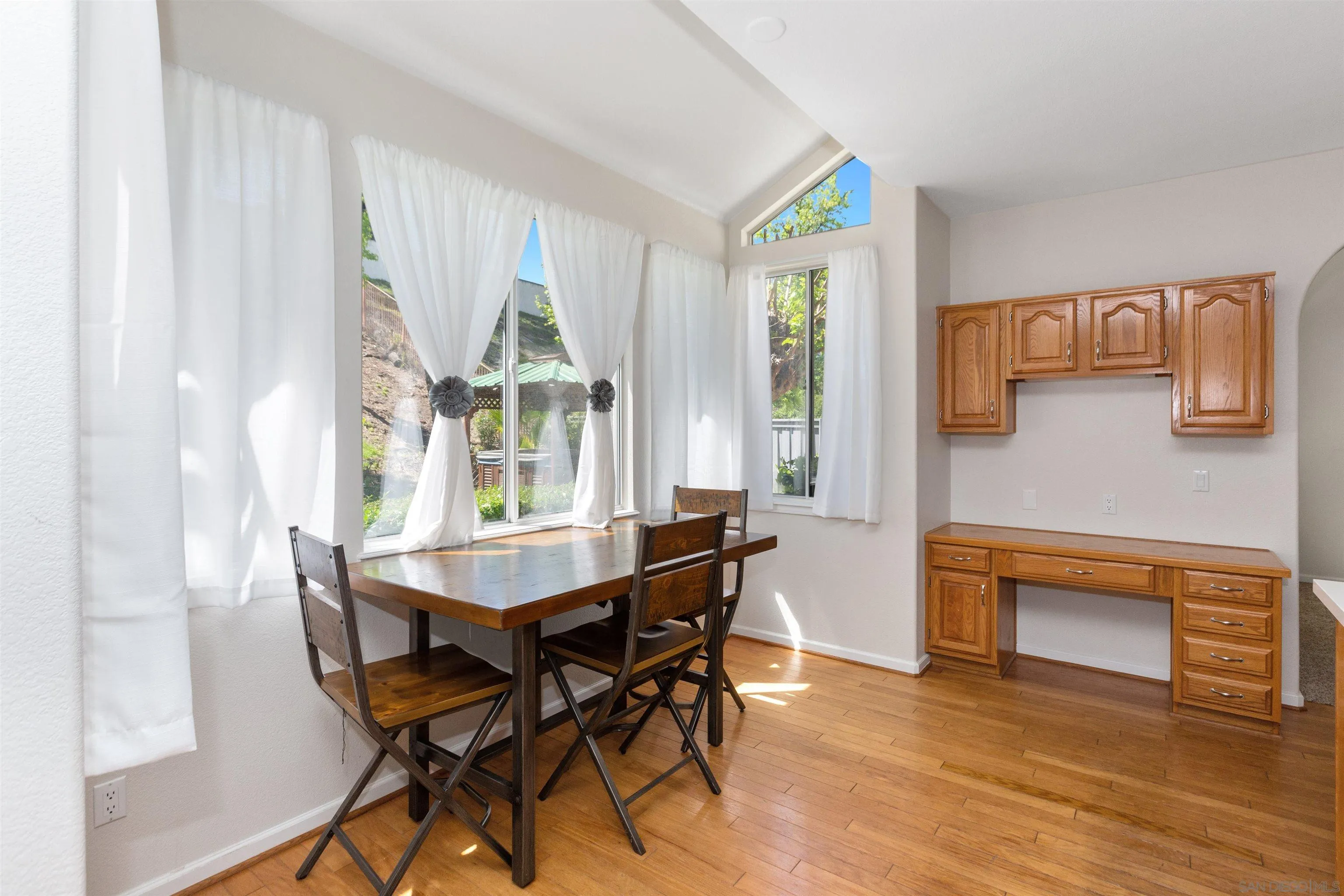 31759 Corte Rosario Temecula, CA 92592 - Photo 16 of 44 a dining room with furniture and wooden floor