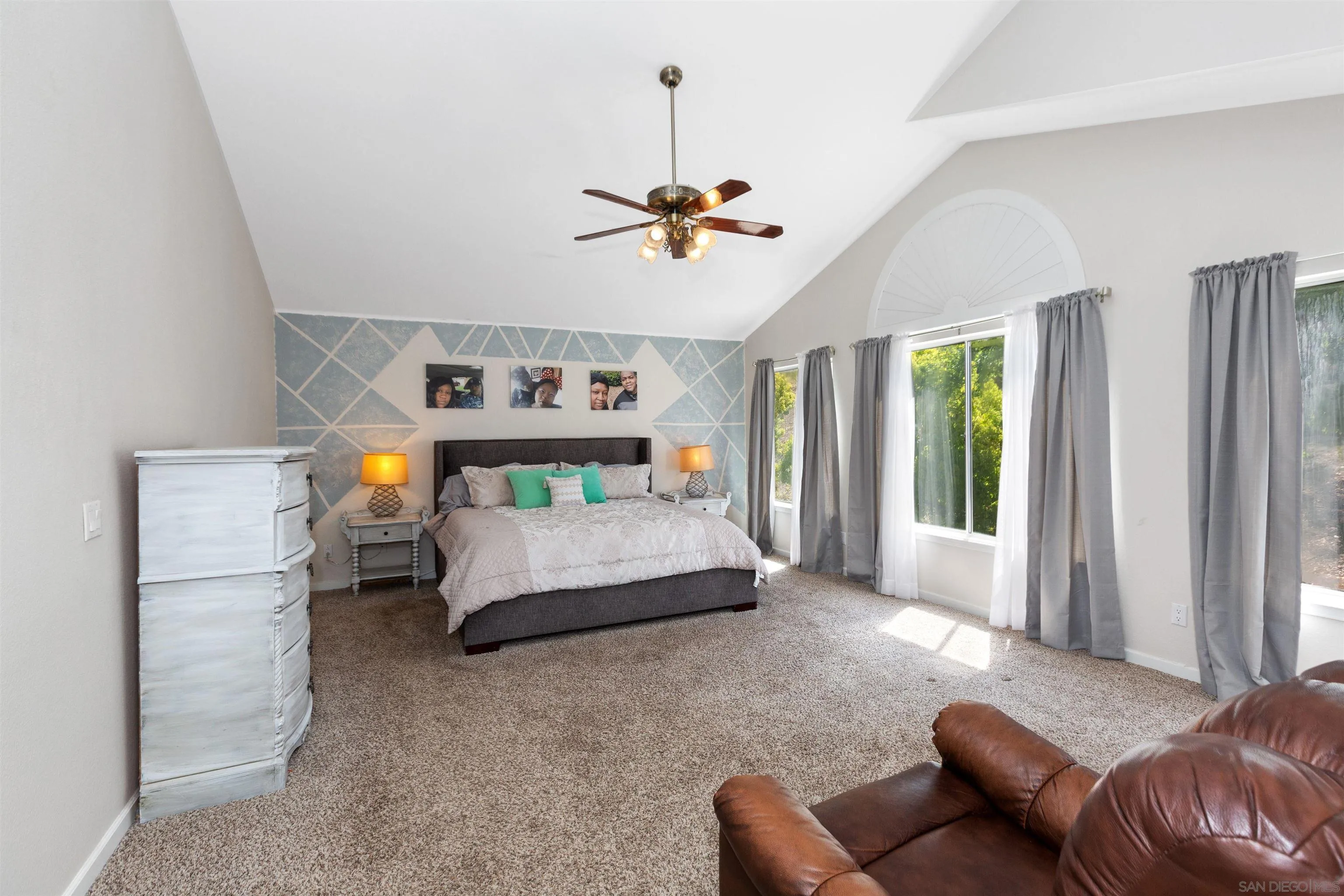 31759 Corte Rosario Temecula, CA 92592 - Photo 23 of 44 a bedroom with furniture and a chandelier