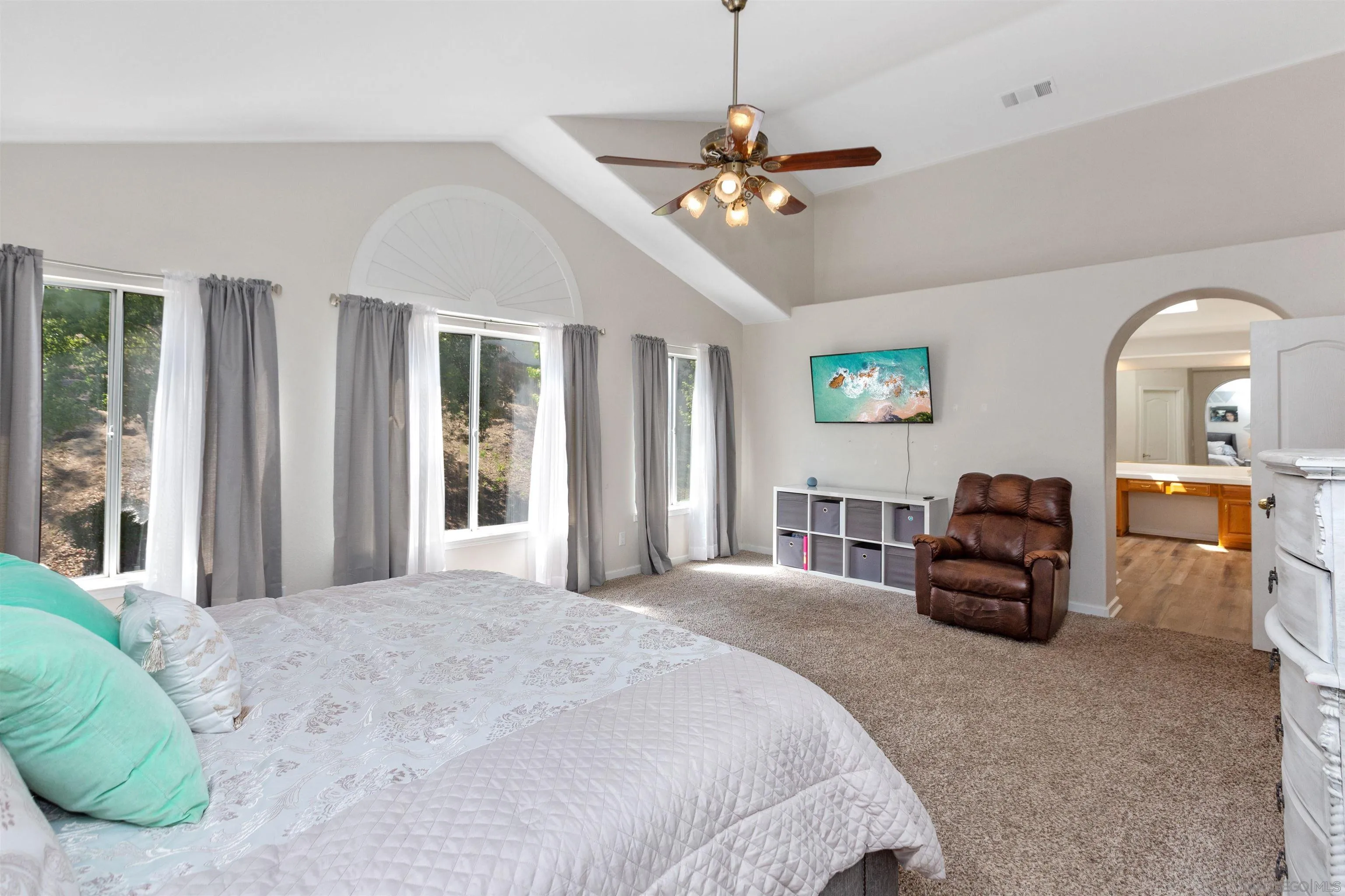 31759 Corte Rosario Temecula, CA 92592 - Photo 24 of 44 a bedroom with a bed and a chandelier