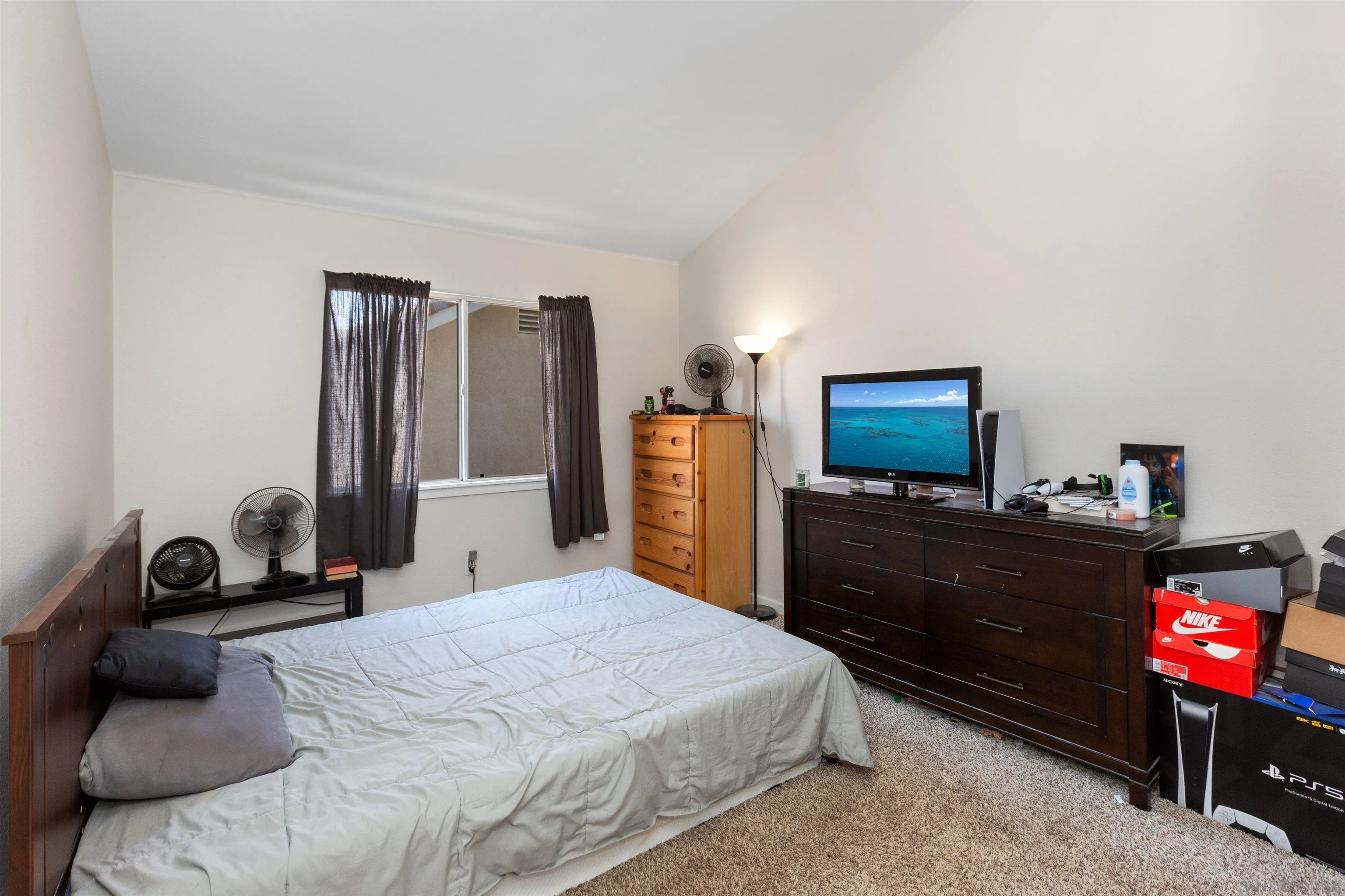 31759 Corte Rosario Temecula, CA 92592 - Photo 26 of 44 a bedroom with a bed and a television