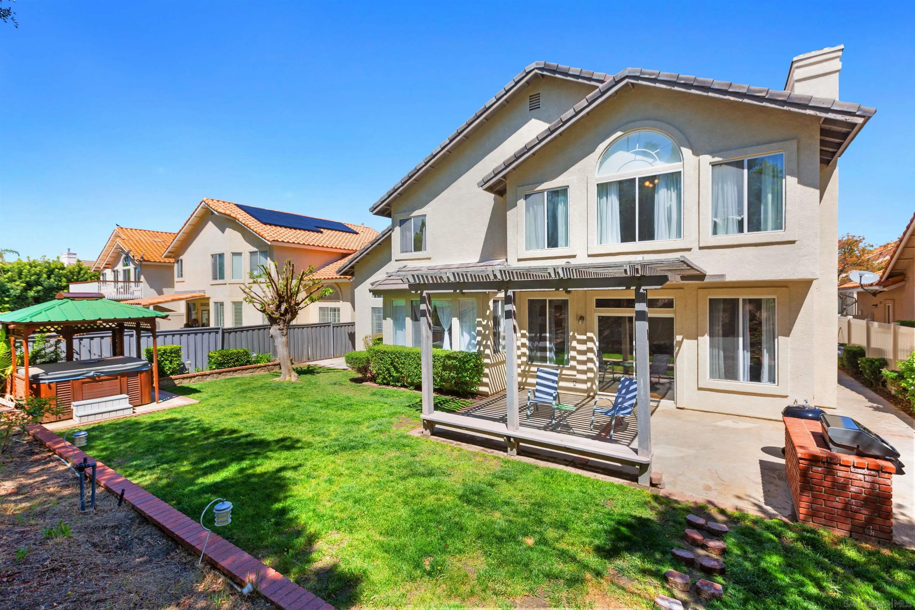 31759 Corte Rosario Temecula, CA 92592 - Photo 32 of 44 a front view of a house with a yard table and chairs