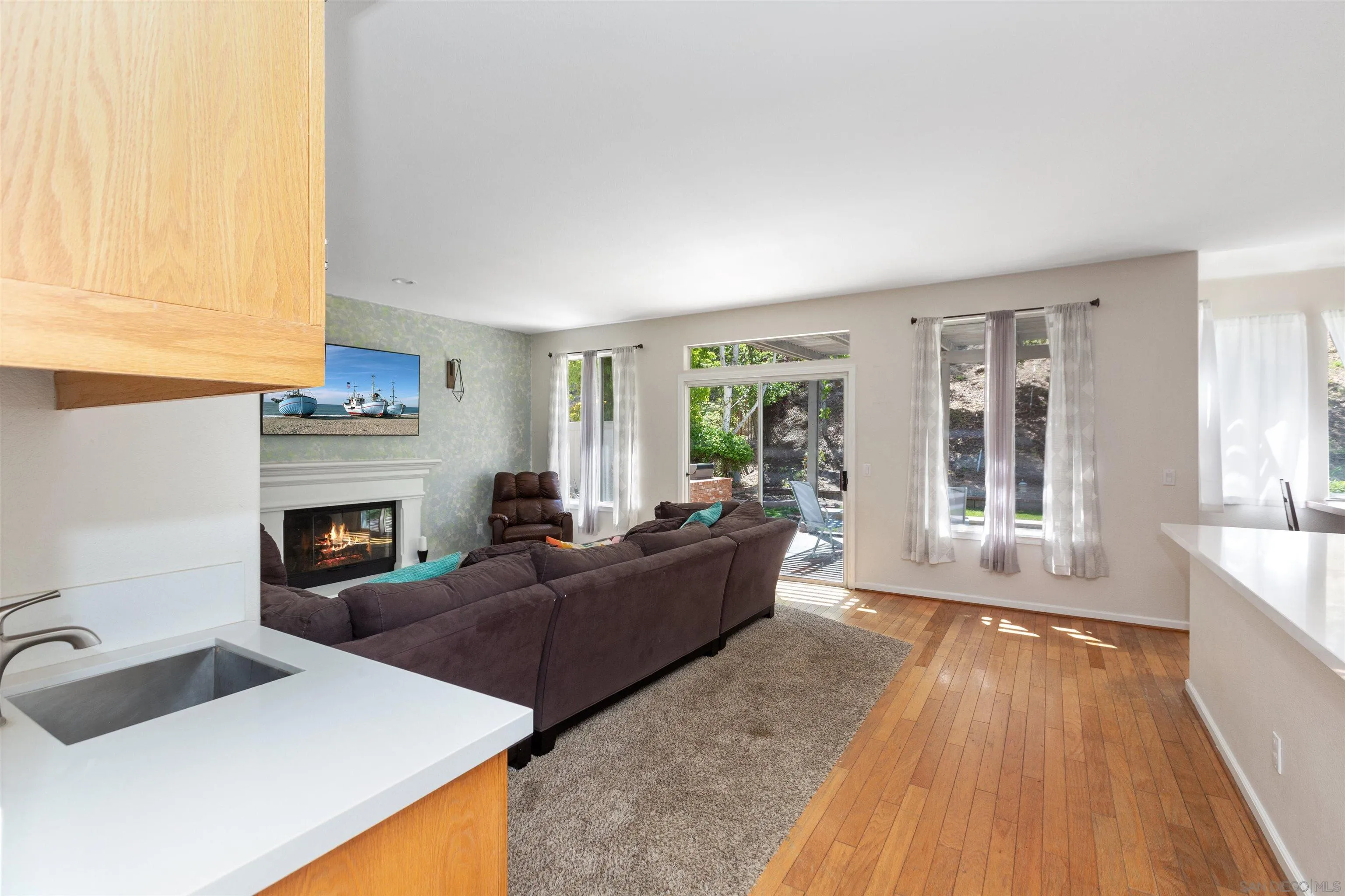 31759 Corte Rosario Temecula, CA 92592 - Photo 10 of 44 a living room with furniture and a fireplace
