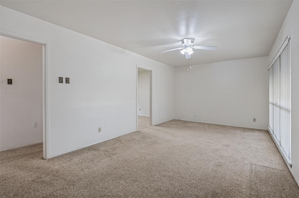 2528 Rugby Lane Farmers Branch, TX 75234 - Photo 8 of 12 Carpeted interior space with a ceiling fan, recessed lighting, and vertical window blinds
