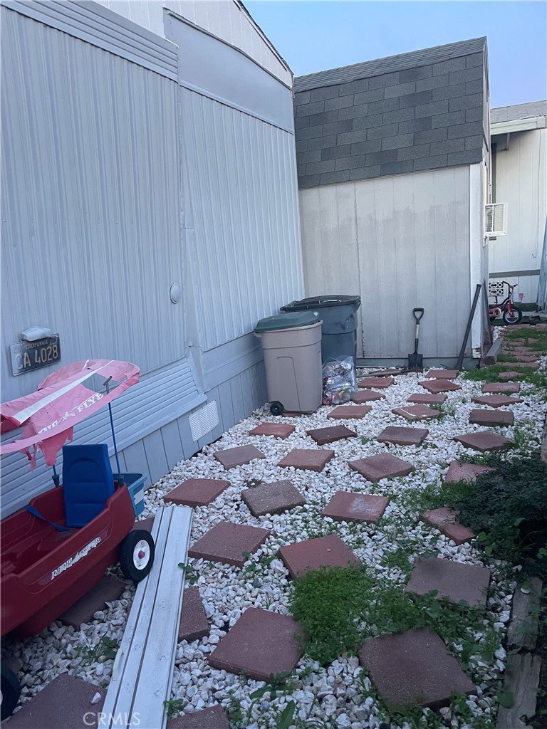 22600 Normandie Avenue, Unit 32 Torrance, CA 90502 - Photo 12 of 40 a bedroom with a bed and a dresser
