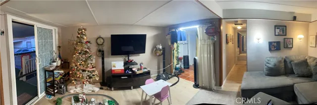 a room with gym equipment and a rug