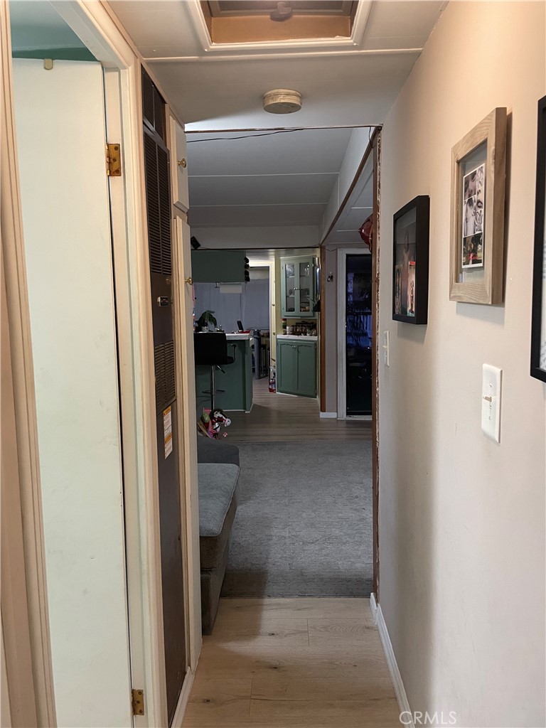 22600 Normandie Avenue, Unit 32 Torrance, CA 90502 - Photo 26 of 40 a view of a hallway with couch and dining room