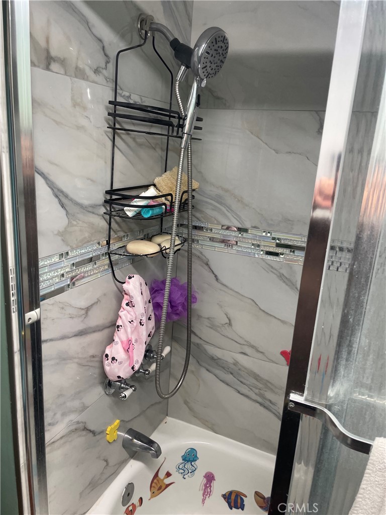 22600 Normandie Avenue, Unit 32 Torrance, CA 90502 - Photo 27 of 40 view of a room with rack and wooden floor