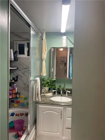 a bed sitting in a bedroom and dresser