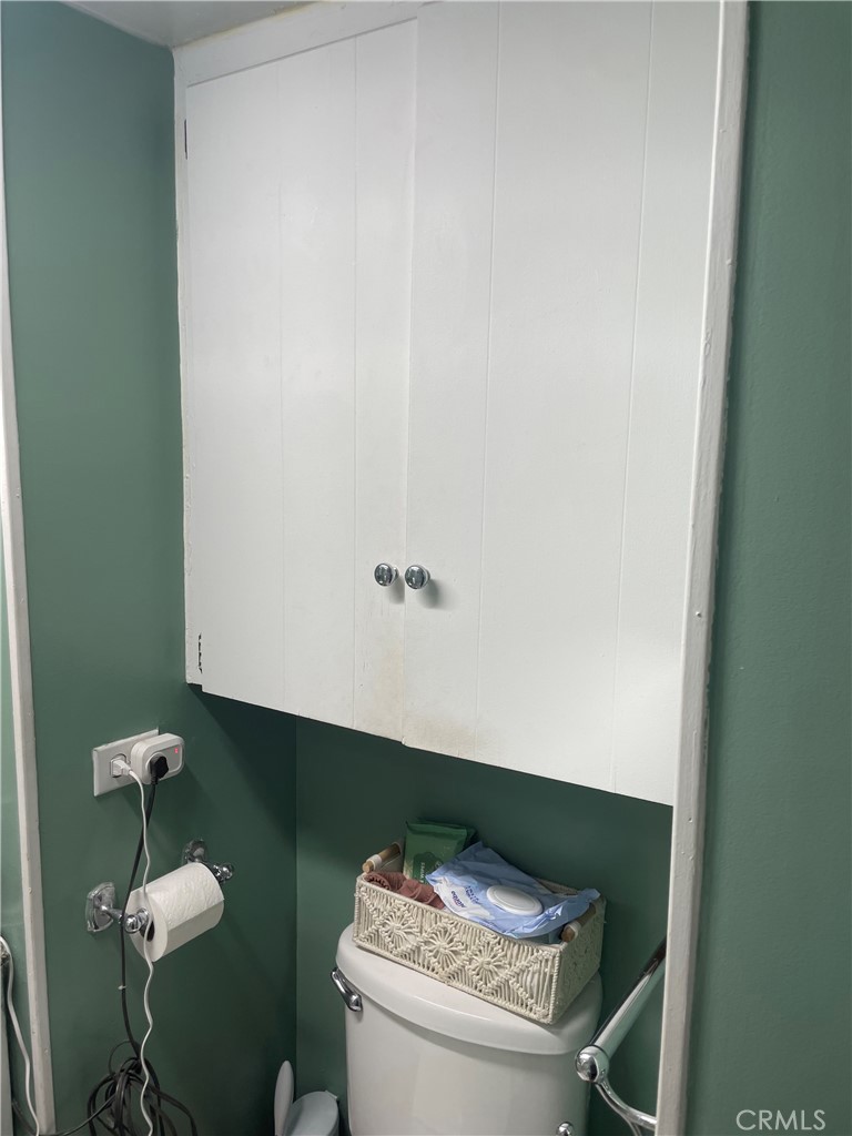 22600 Normandie Avenue, Unit 32 Torrance, CA 90502 - Photo 32 of 40 a bathroom with a granite countertop sink and a toilet