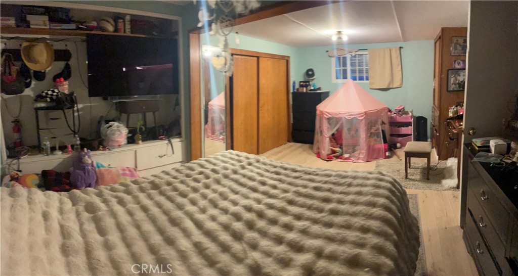 22600 Normandie Avenue, Unit 32 Torrance, CA 90502 - Photo 34 of 40 a bedroom with a bed and a lamp