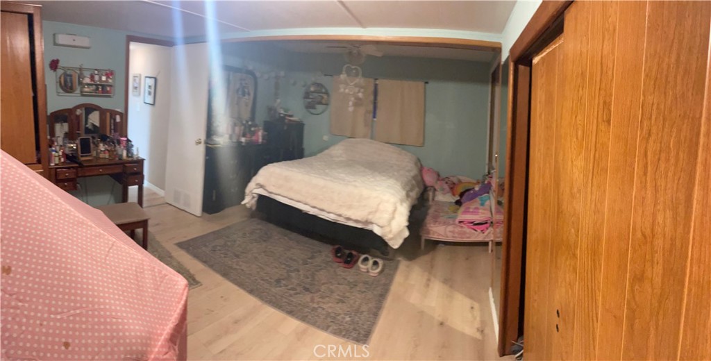 22600 Normandie Avenue, Unit 32 Torrance, CA 90502 - Photo 35 of 40 a bedroom with a bed and a large mirror