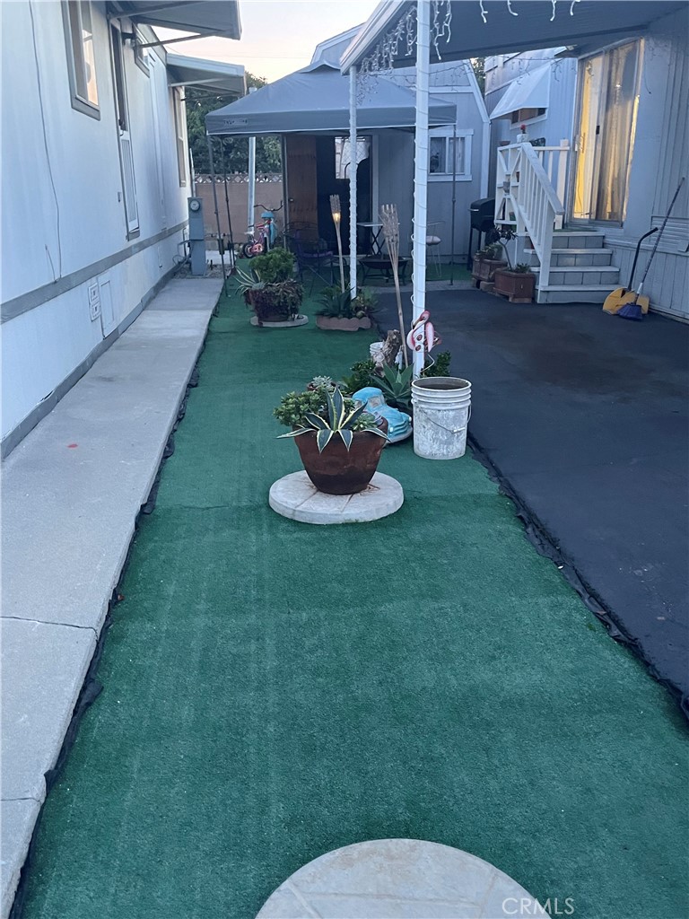 22600 Normandie Avenue, Unit 32 Torrance, CA 90502 - Photo 5 of 40 a backyard of a house with fountain table and chairs