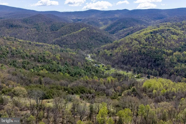 a view of mountains and valleys