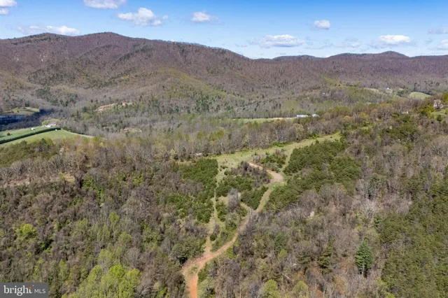 a view of a town with mountains in the background