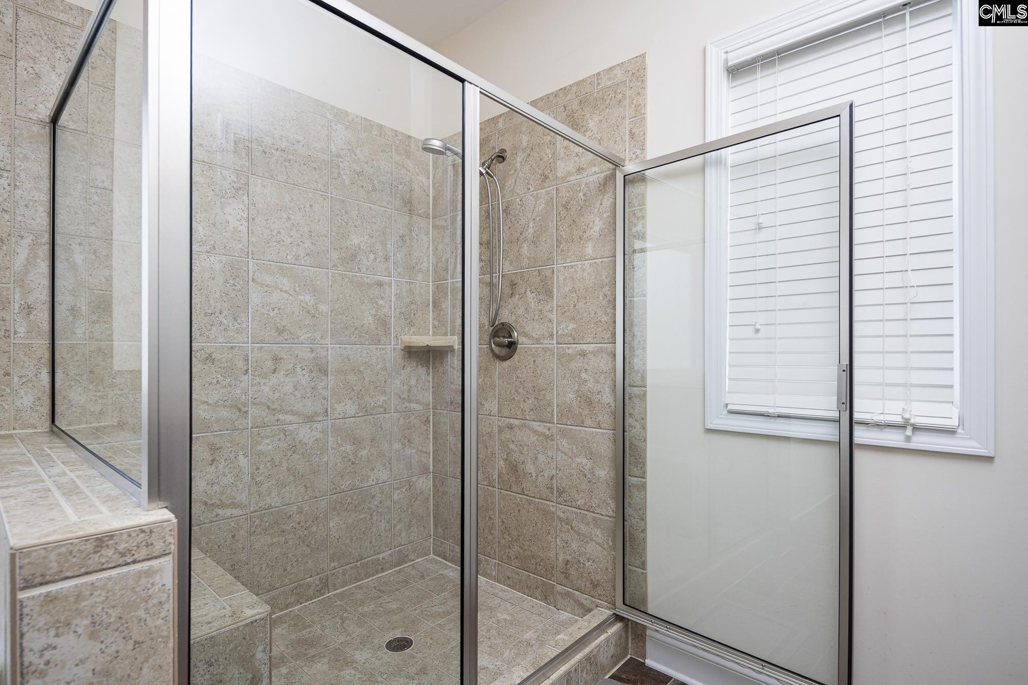 213 Sunset Point Drive Lexington, SC 29072 - Photo 22 of 35 a bathroom with a shower