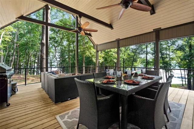 a view of outdoor space with deck and yard