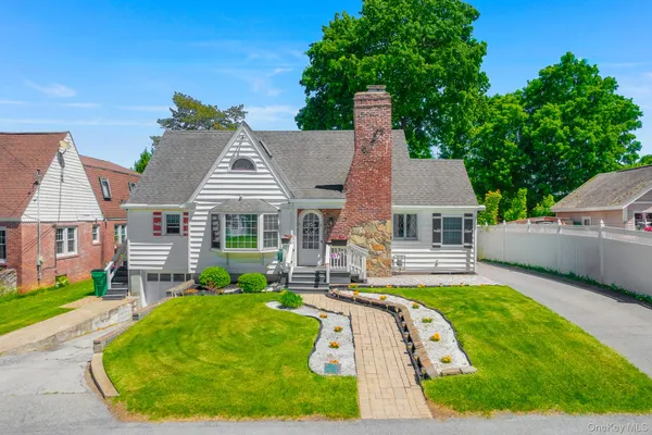 front view of a house with a yard