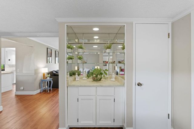 a view of a hallway and dining room
