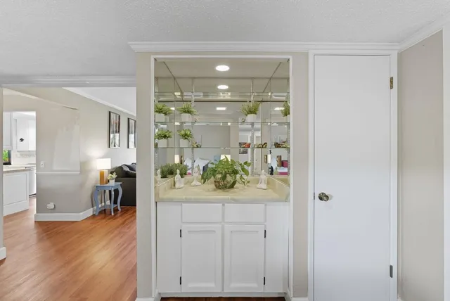 a view of a hallway and dining room