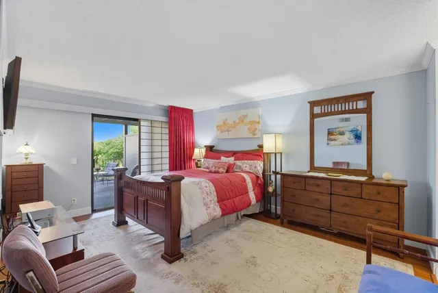 a bed room with a bed window and a dresser