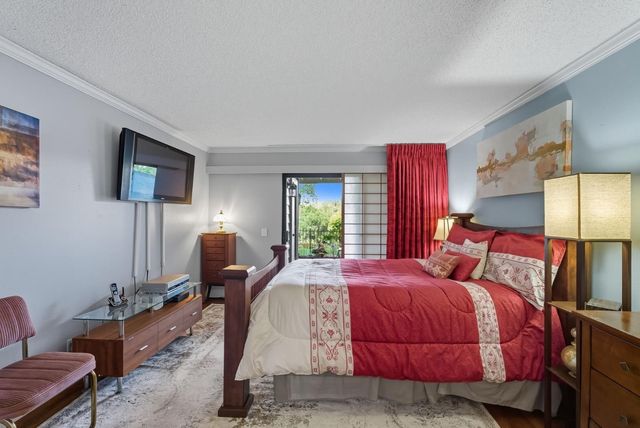 a bedroom with bed and window