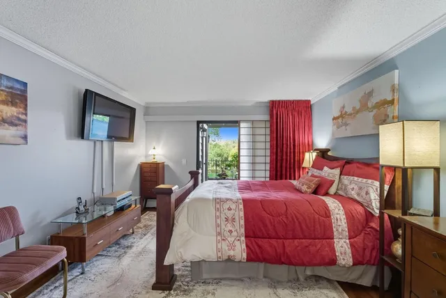 a bedroom with bed and window