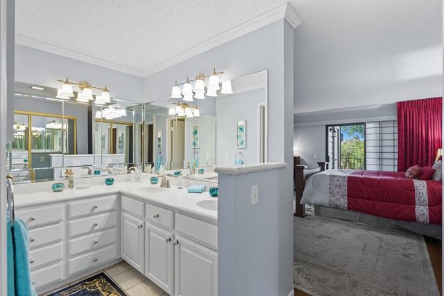 a spacious bathroom with a double vanity sink mirror and double
