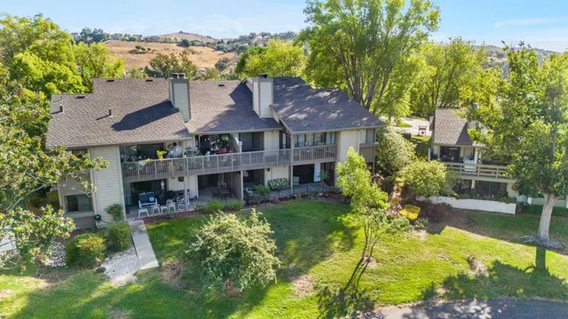 an aerial view of a house with a garden and plants