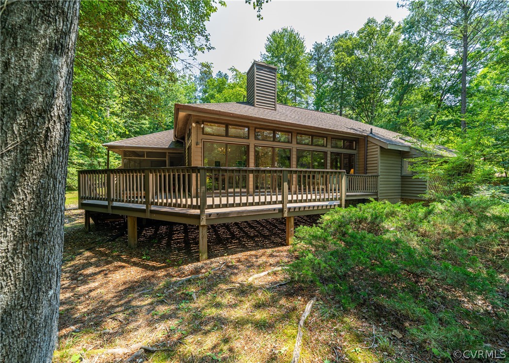 3708 Commodore Point Circle Midlothian, VA 23112 - Photo 1 of 46 a view of a deck with a chair and trees
