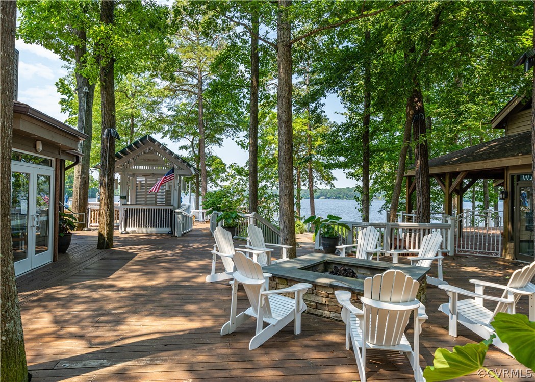 3708 Commodore Point Circle Midlothian, VA 23112 - Photo 13 of 46 a view of a patio with table and chairs and floor to ceiling window