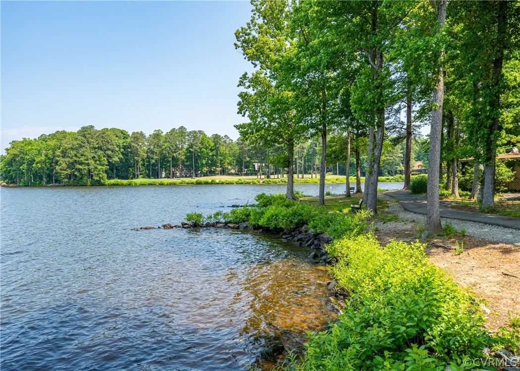 3708 Commodore Point Circle Midlothian, VA 23112 - Photo 3 of 46 a view of a lake with a yard