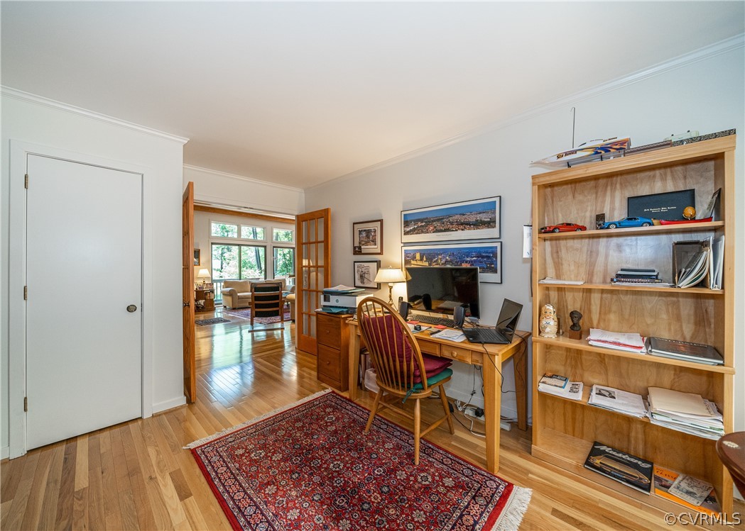 3708 Commodore Point Circle Midlothian, VA 23112 - Photo 33 of 46 a work room with furniture wooden floor and a book shelf