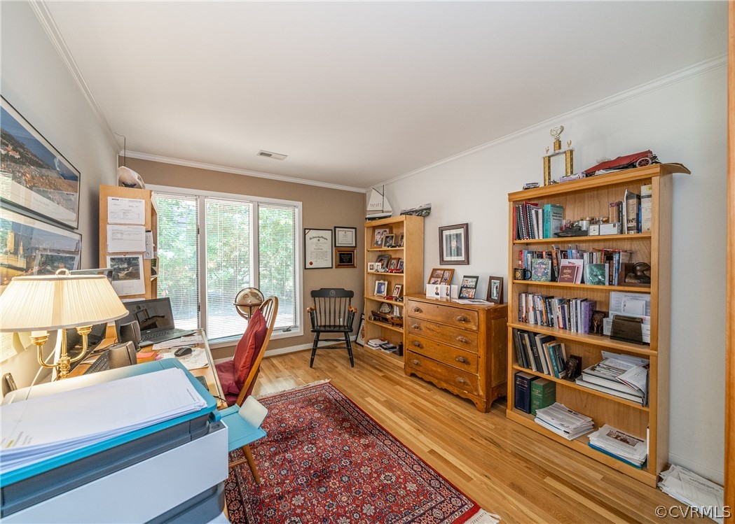 3708 Commodore Point Circle Midlothian, VA 23112 - Photo 34 of 46 a living room with furniture a rug and a bookshelf