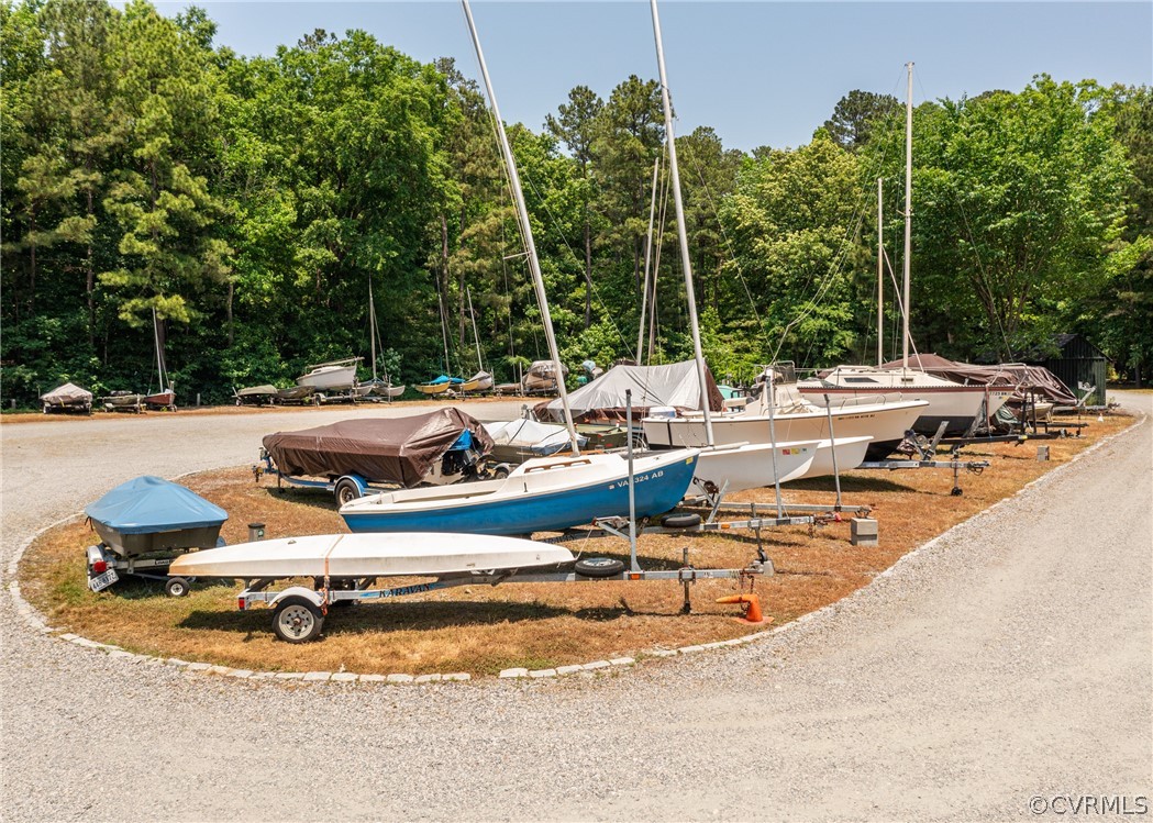3708 Commodore Point Circle Midlothian, VA 23112 - Photo 4 of 46 a view of swimming pool with outdoor seating and trees in the background