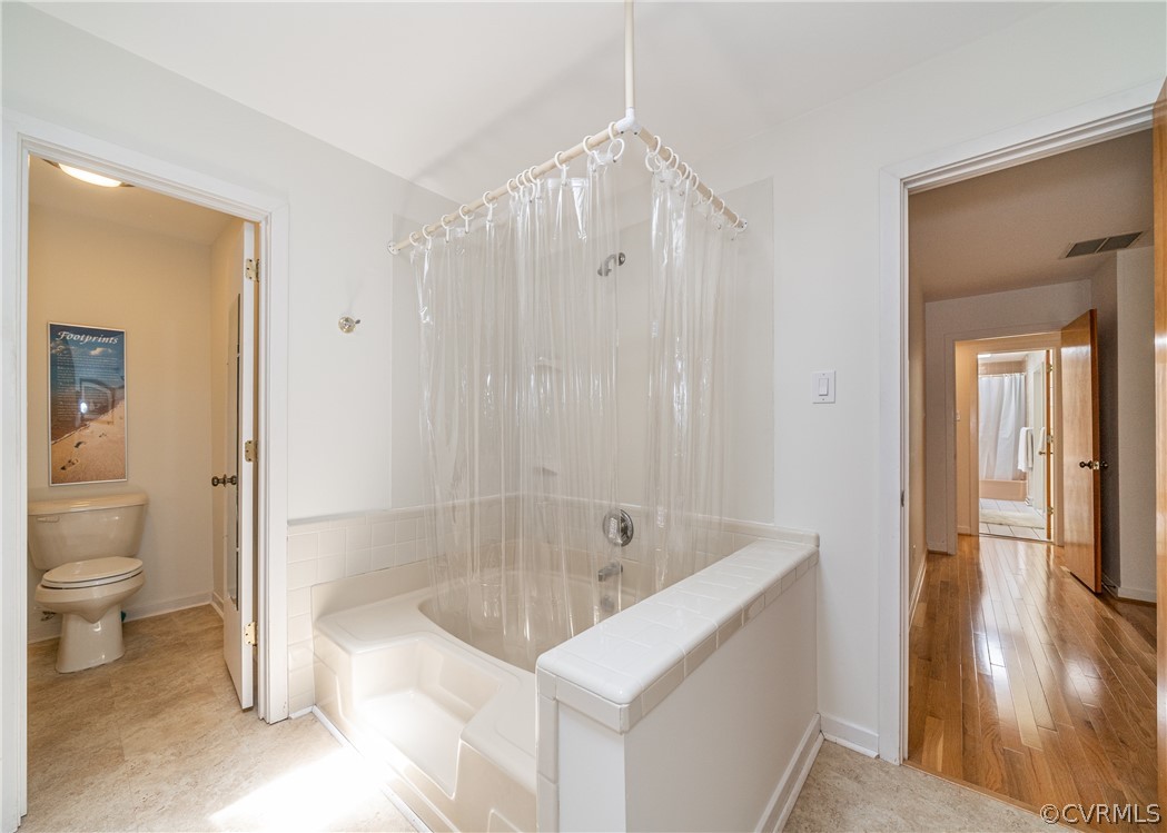 3708 Commodore Point Circle Midlothian, VA 23112 - Photo 42 of 46 a bathroom with a granite countertop sink a toilet and shower