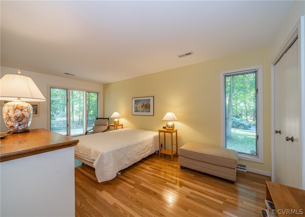 3708 Commodore Point Circle Midlothian, VA 23112 - Photo 44 of 46 a bedroom with a bed and wooden floor