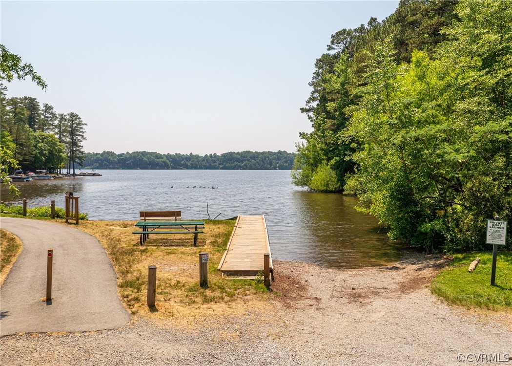 3708 Commodore Point Circle Midlothian, VA 23112 - Photo 5 of 46 a view of a lake with a table and chairs