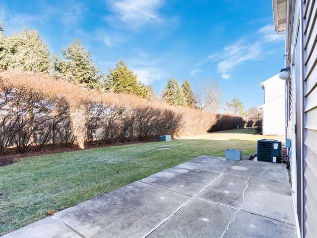 a backyard of a house with lots of green space